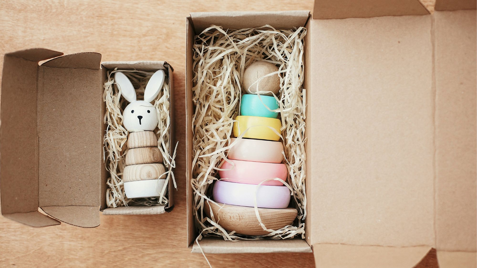 Wooden rabbit toy and pastel stacker in eco-friendly packaging – part of C2 Fashion Studio’s Creative Innovations Trend.