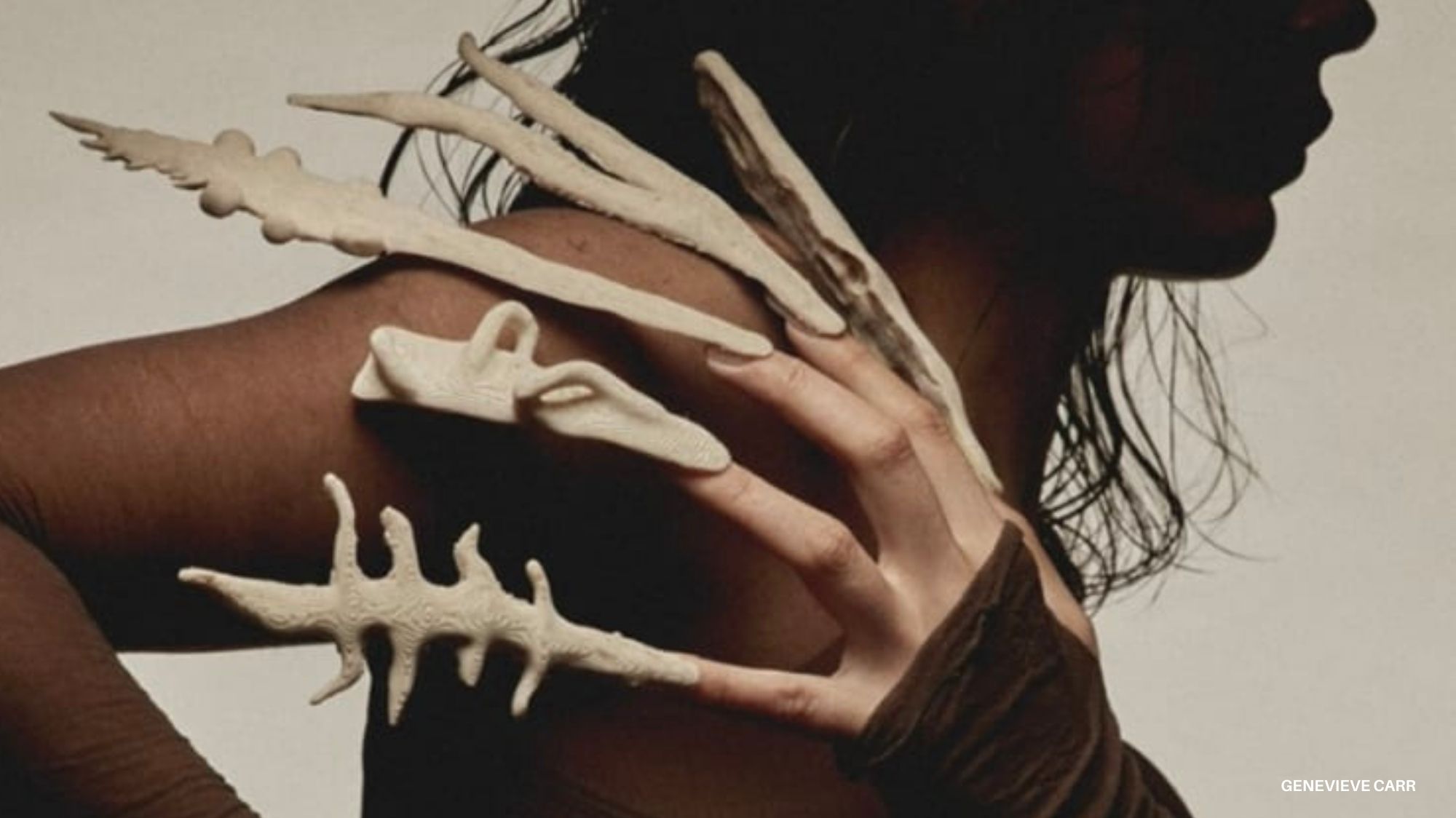 Avant-garde fashion design with sculptural bone-inspired accessories on a model’s back, symbolizing biomimicry and experimental aesthetics in trend forecasting for Spring Summer 2027 2028 by C2 Fashion Studio, a leading trend forecasting agency.