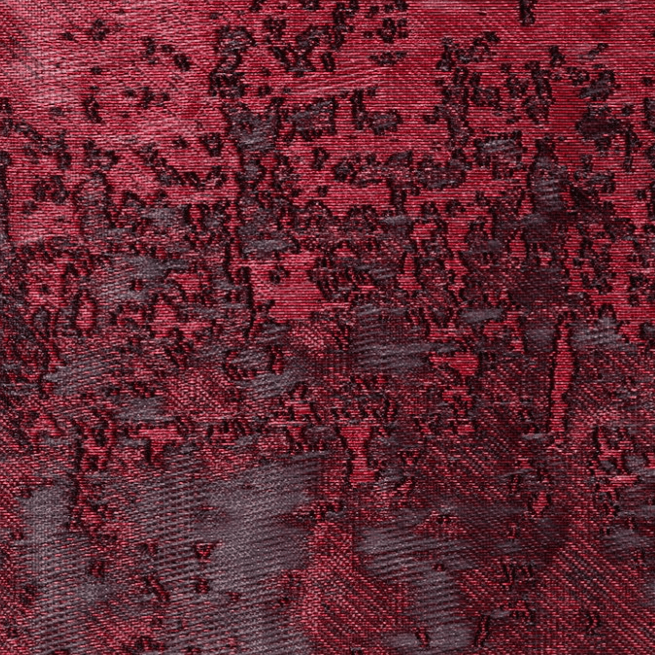 Close-up of textured red and black fabric, symbolizing Autumn Winter 2027 2028 fashion trend forecasting with themes of quiet opulence, resilience, and cultural memory.