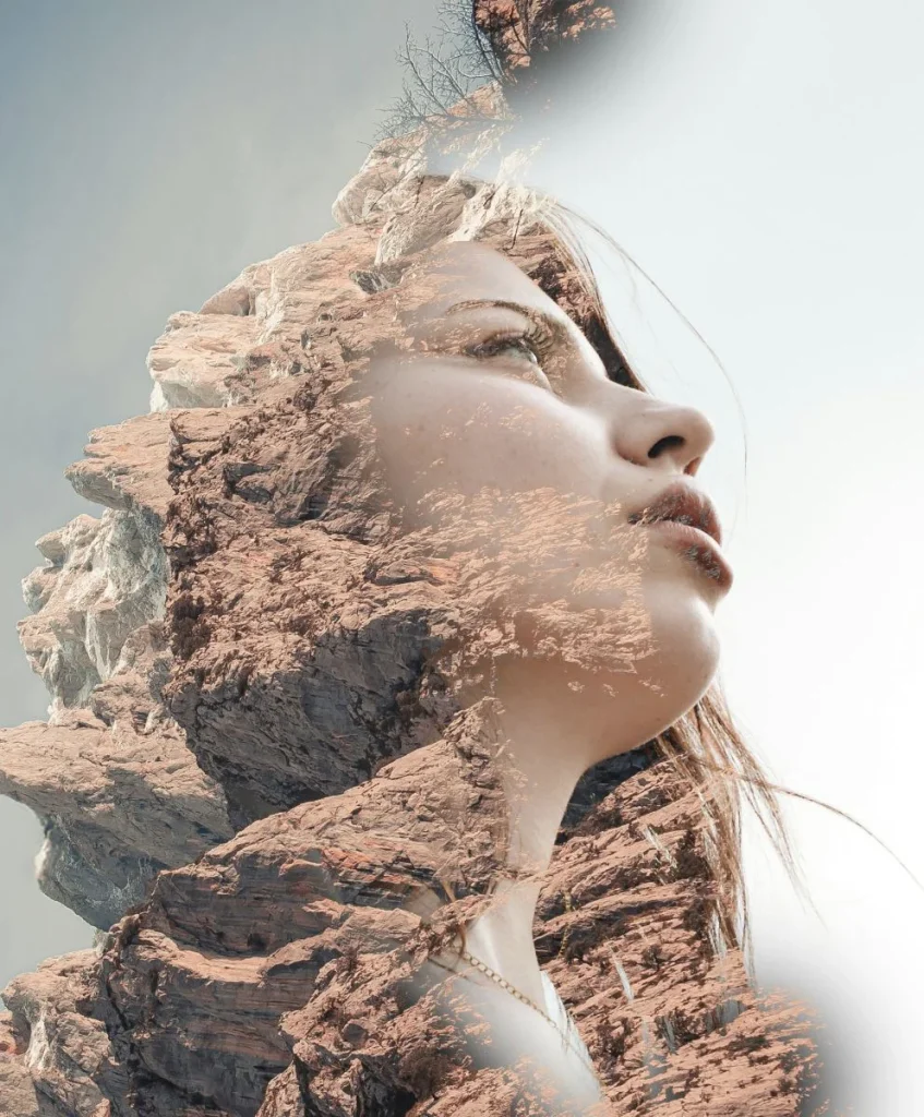 Artistic double exposure of a woman’s face merged with rocky mountains, symbolizing emotional durability and resilience in fashion. Created for C2 Fashion Studio’s work in trend forecasting as a leading trend forecasting agency.