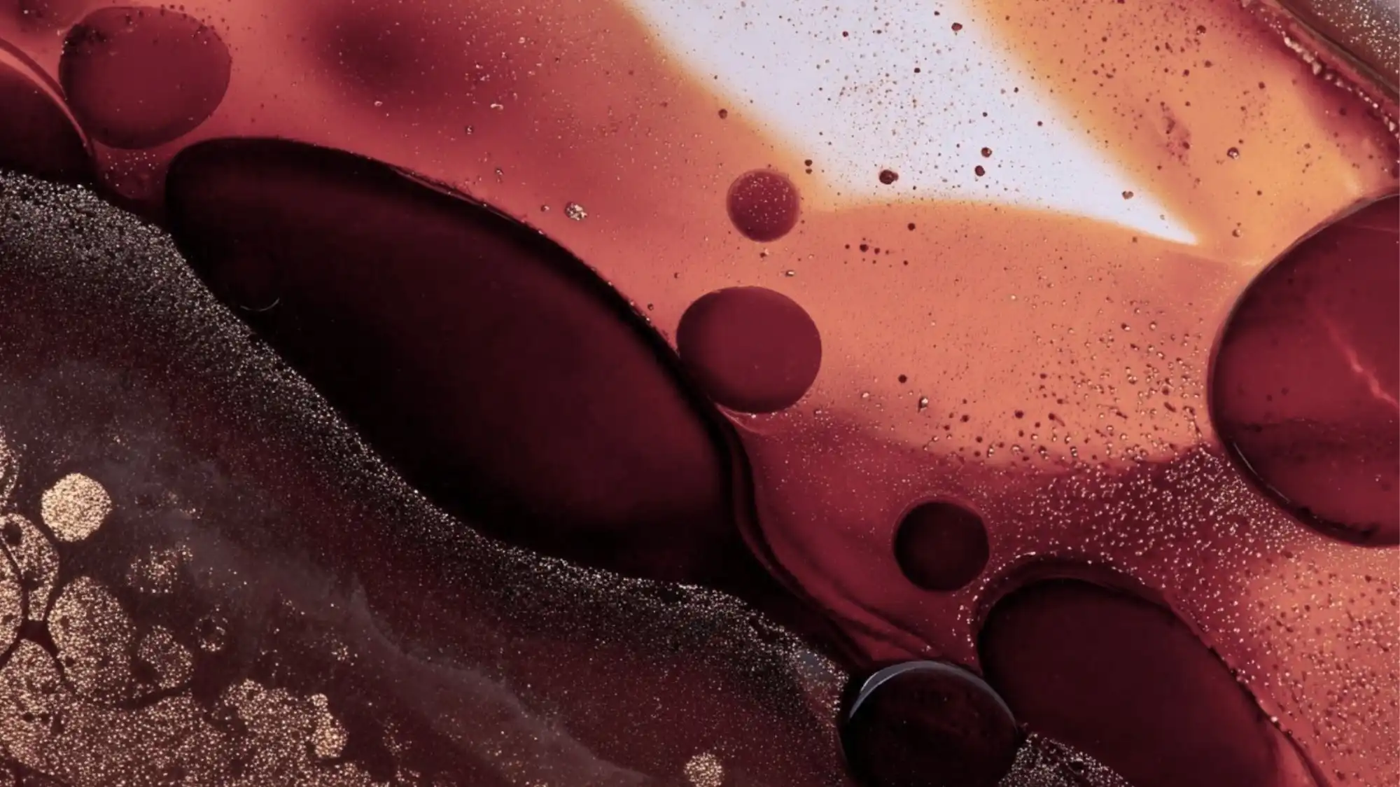 Abstract macro image blending burgundy, terracotta, and amber tones — representing the tactile richness and emotional depth of Grounded Opulence, the key Autumn Winter 2027 2028 Fashion Trend decoded by C2 Fashion Studio’s Trend Forecasting.