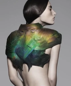Model wearing an iridescent, bio-reactive garment inspired by Neuro-Sensory Design — representing the fusion of neuroscience, aesthetic intelligence, and emotional technology in Fashion Trend Forecasting for Spring Summer 2027 by C2 Fashion Studio.