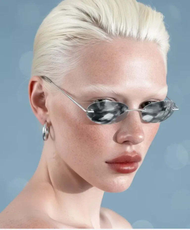 Model wearing futuristic chrome sunglasses representing adaptive fashion and emotional design — part of C2 Fashion Studio’s Fluid Identities trend forecasting for future fashion and design innovation.