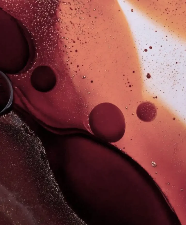 Abstract visual of rich burgundy and terracotta liquid textures symbolizing the tactile and emotional depth of Grounded Opulence, the Autumn Winter 2027 2028 Fashion Trend revealed through C2 Fashion Studio’s advanced Trend Forecasting.