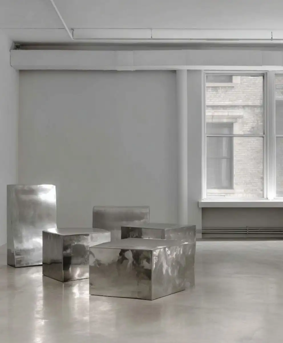 Minimalist metallic furniture in a modern studio space symbolizing C2 Fashion Studio’s global vision in trend forecasting, creativity, and cultural intelligence for future fashion innovation.