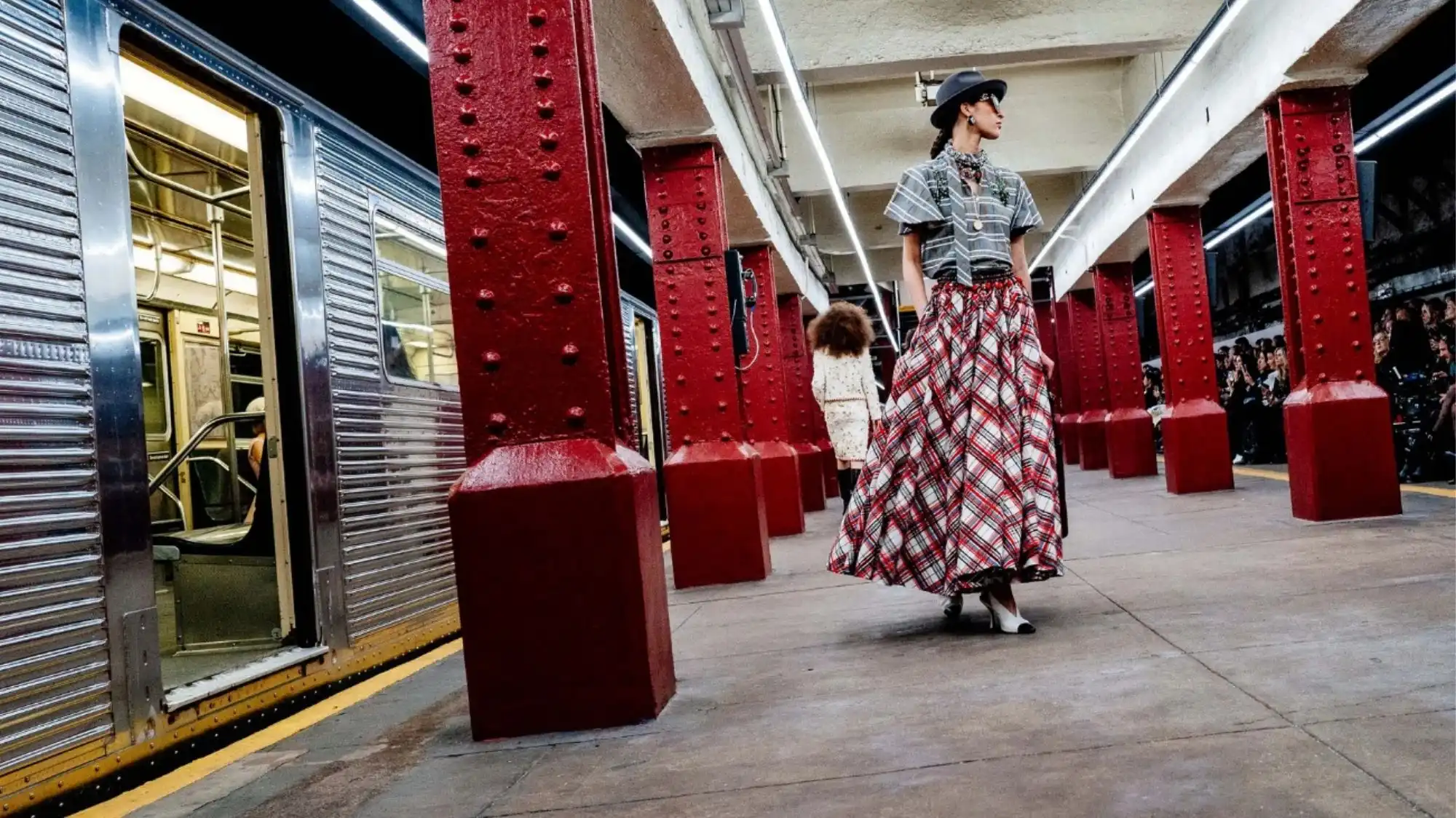Pre-Fall 2026/27 fashion show staged in an urban subway setting, illustrating strategic fashion presentation, narrative context and trend forecasting evolution.