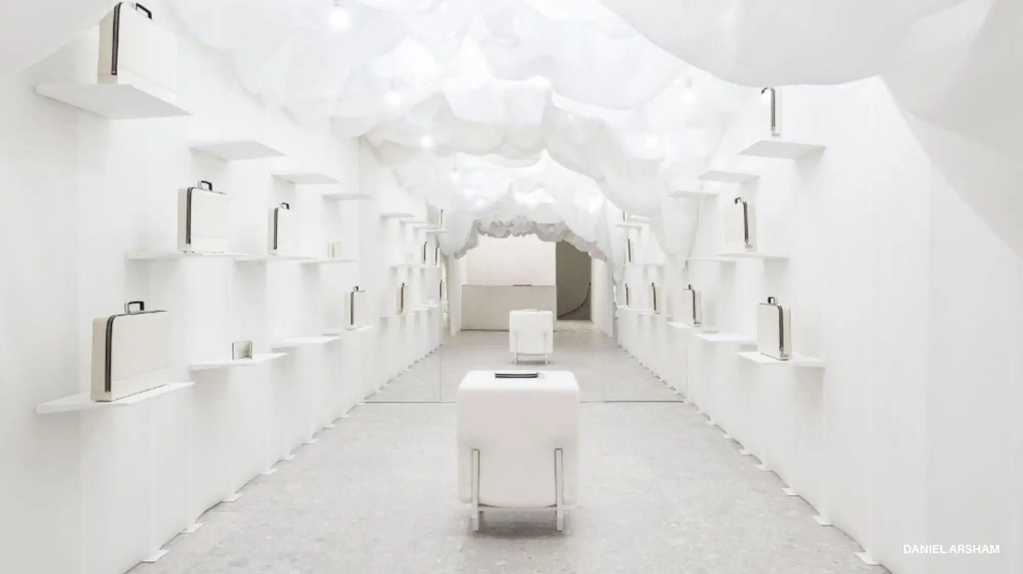 White minimalist installation by Daniel Arsham featuring cloud-like ceiling forms and sculptural white objects, illustrating the refined clarity and purified aesthetic inspired by Cloud Dancer, Pantone Color of the Year 2026.