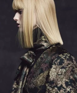 Model in metallic textured jacquard for Autumn Winter 2027–2028, reflecting C2 Fashion Studio’s Trend Forecast macro forces: Adaptive Belonging, Grounded Opulence, and Regenerative Intelligence shaping the Future of Fashion and Design.