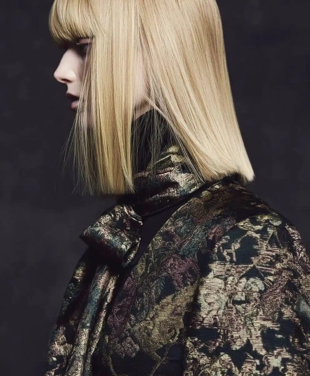 Model in metallic textured jacquard for Autumn Winter 2027–2028, reflecting C2 Fashion Studio’s Trend Forecast macro forces: Adaptive Belonging, Grounded Opulence, and Regenerative Intelligence shaping the Future of Fashion and Design.