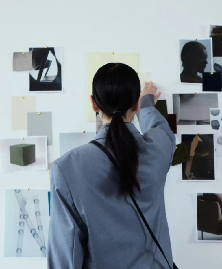 Fashion professional analyzing visual research and concept boards inside the C2 Trend Platform, showcasing advanced intelligence for strategic fashion trend forecasting.