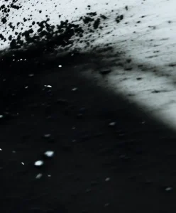 Abstract black-and-white material surface expressing material intelligence evolution, from static textures to active systems in AW27/28 fashion trend forecasting.