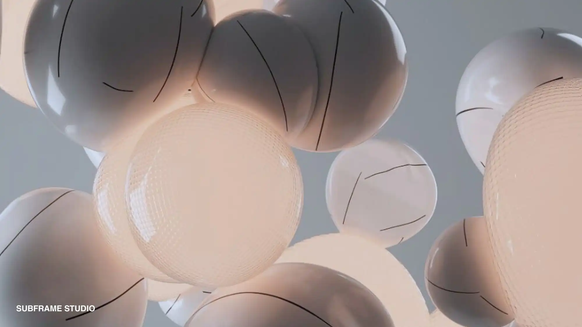 Close‑up of clustered soft white and peach spherical forms with fine surface lines, suggesting inflated textile capsules and smart material bubbles for C2 Fashion Studio trend forecasting solutions.