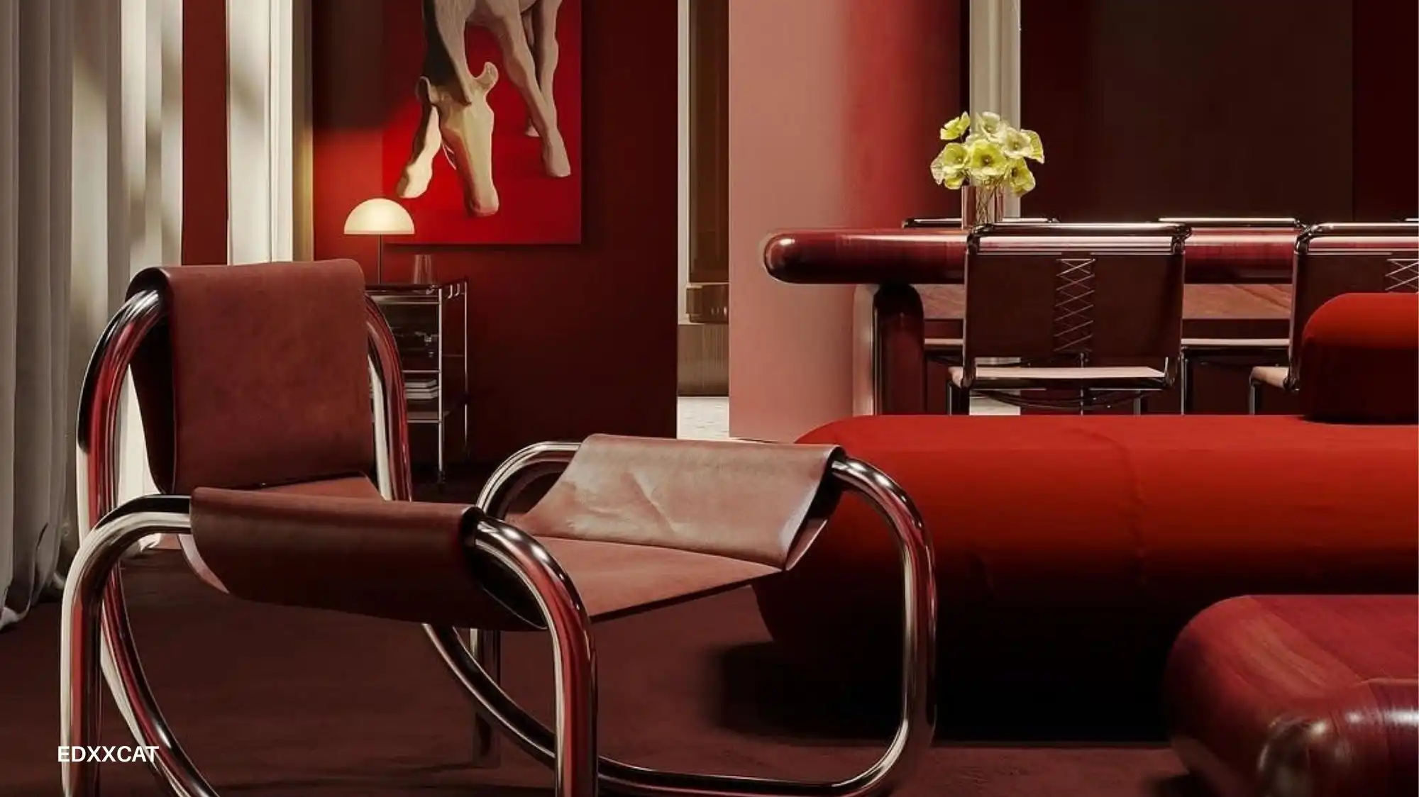 Warm red interior with chrome‑framed leather chairs, rounded seating and a dining table, illustrating April 2026 design trends where fashion, interiors and lifestyle aesthetics converge.