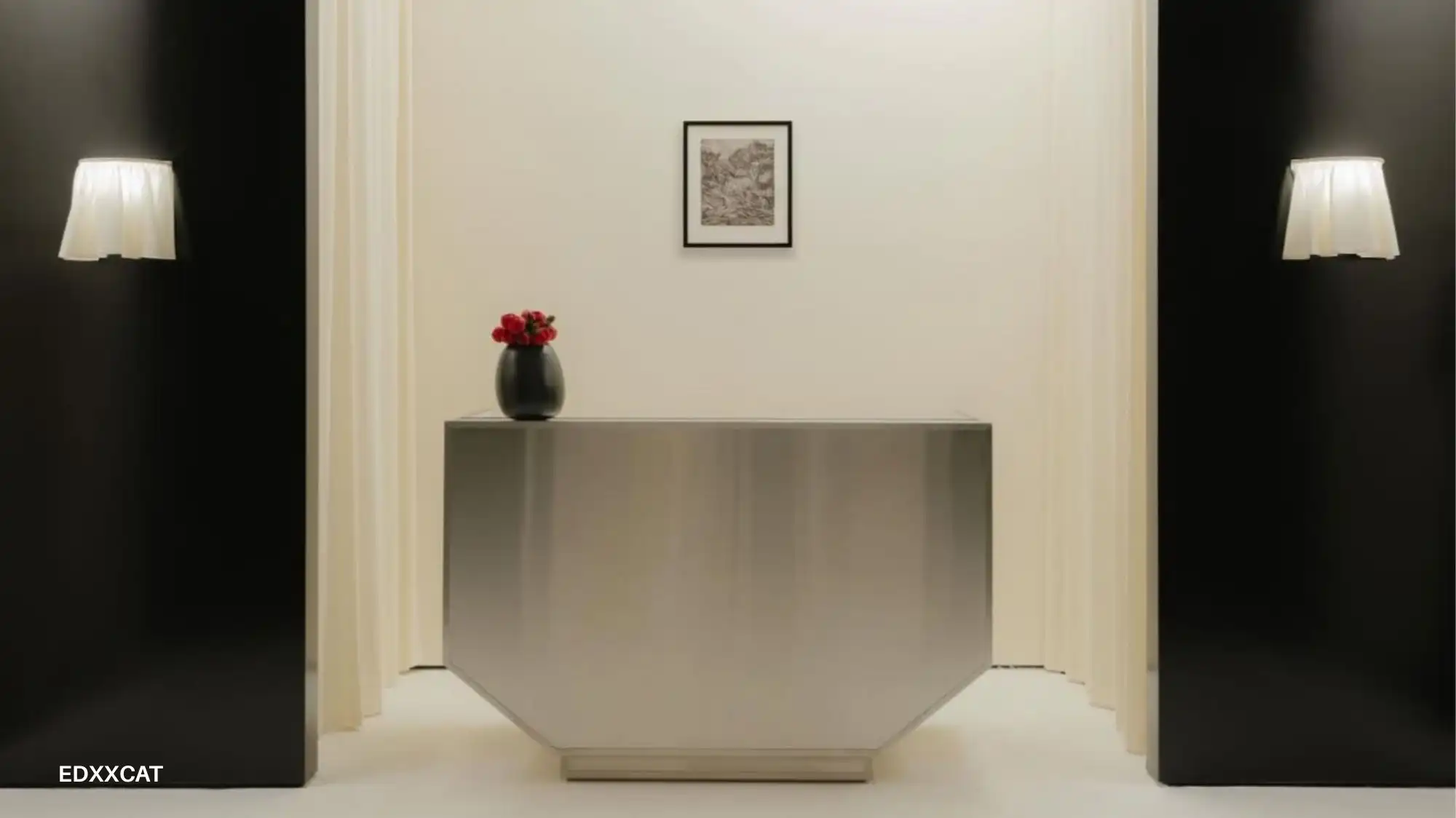 Minimalist interior with a central stainless‑steel counter, black side walls, soft cream curtains, wall lights and a single vase of red flowers, reflecting refined April 2026 fashion and design aesthetics.
