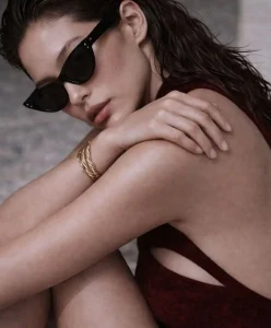 Beachwear Autumn Winter 2027 2028 fashion trend forecasting, grounded resonance resortwear with textured fabric, asymmetrical cutout swimsuit, emotional depth aesthetic