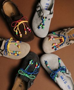 Suede Birkenstock clogs customized with beaded cord laces — Play Power 2027 fashion trend forecasting by C2 Fashion Studio.