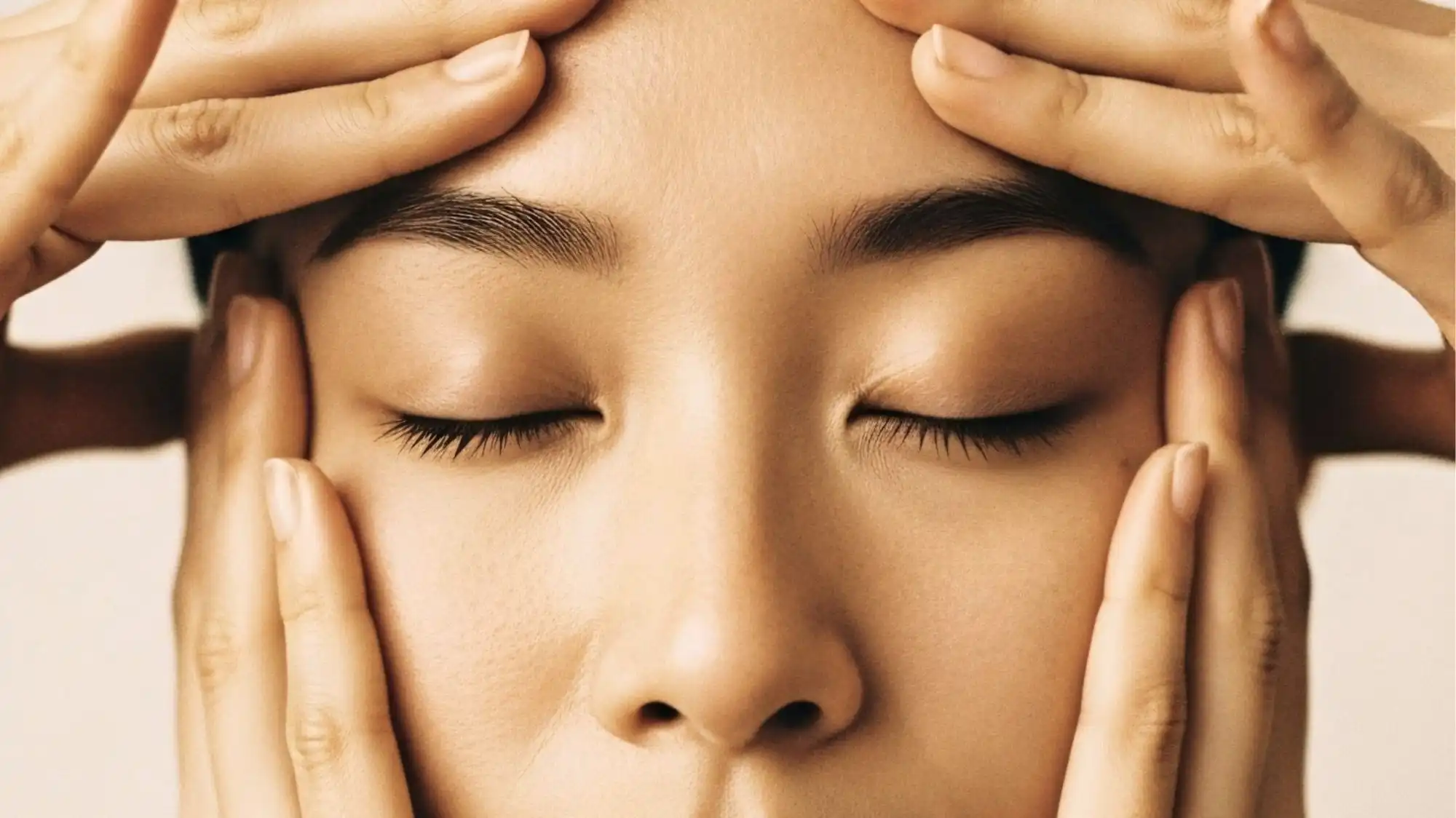 Close-up of a relaxing facial massage representing longevity wellness, regenerative beauty, stress reduction and holistic skincare. Image by C2 Fashion Studio Trend Forecasting highlighting wellness rituals, healthy ageing and future beauty trends.