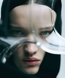 Conceptual fashion portrait illustrating the future of product desirability through transparent lenses and minimal styling. C2 Fashion Studio Fashion Trend Forecasting explores how Trend Intelligence and Trend Forecasting redefine emotional value, consumer perception and product relevance for 2028.