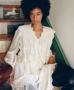 Spring Summer 2028 fashion trend forecasting featuring a romantic white lace dress with heirloom-inspired craftsmanship, emotional durability, and timeless design. Trend Intelligence by C2 Fashion Studio.