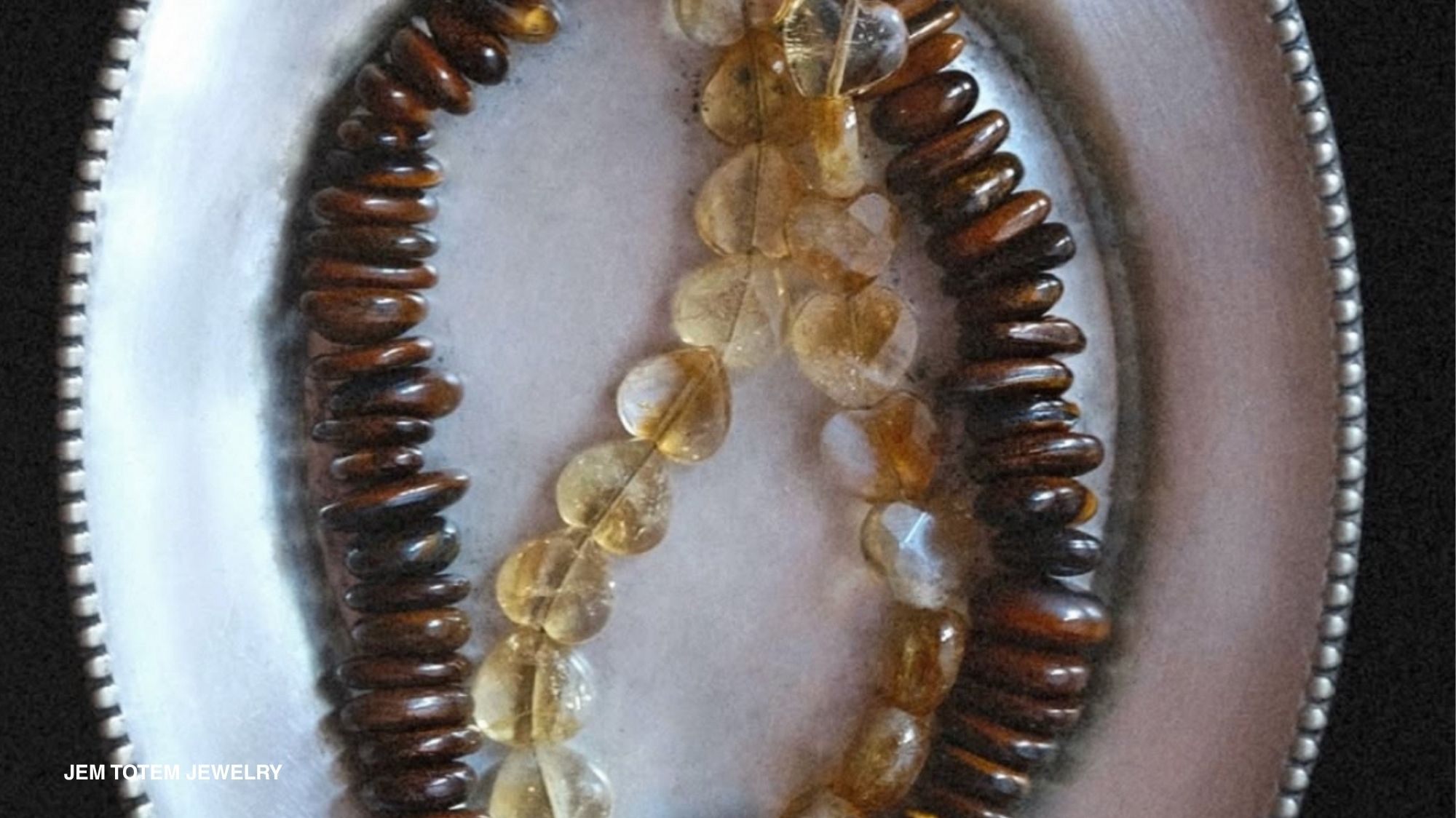 Spring Summer 2028 jewelry featuring amber-toned natural stones and organic bead formations, reflecting C2 Fashion Studio Fashion Trend Forecasting and new material naturalism.