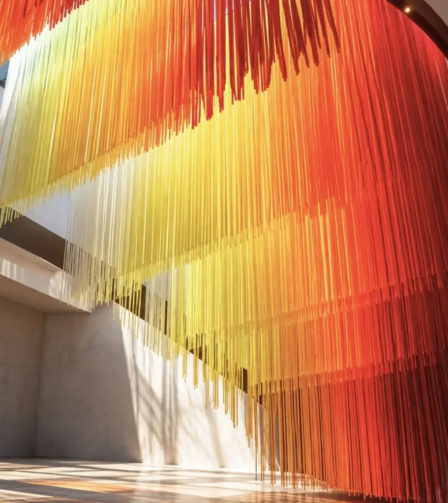 Colour installation in vibrant yellow, orange and red tones illustrating New York Fashion Week Spring Summer 2027 colour trends by C2 Fashion Studio.