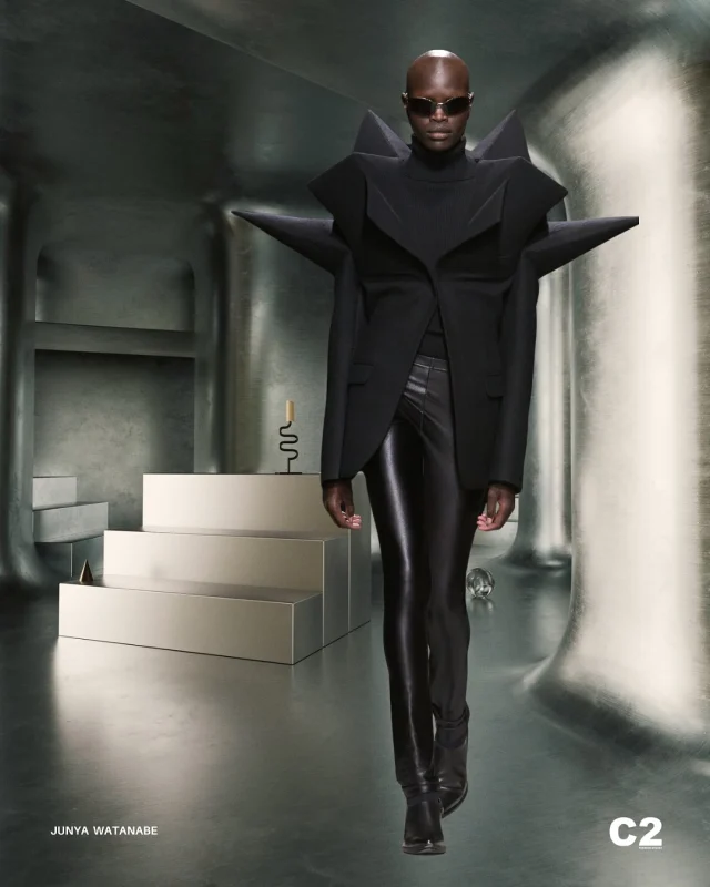 Artistic Rebellion: Sculptural Power Meets Avant-Garde Electric Edge

Junya Watanabe’s visionary design boldly merges architectural precision with the rebellious energy of rock music, inspired by Jimi Hendrix’s boundary-breaking spirit. The dramatic, angular structure of this jacket asserts a sculptural presence, translating Cubist fragmentation into an assertive statement of modern individuality. Its sharp geometry, coupled with sleek, reflective trousers, crafts a silhouette that is both powerful and sophisticated. Watanabe’s avant-garde expression redefines garments as dynamic experiences, embodiments of intangible musical rhythms, positioning fashion as a radical, transformative art form that challenges traditional aesthetics and celebrates creative freedom with unapologetic confidence.

#C2FashionStudio #C2TrendPlatform #ArtisticRebellion #JunyaWatanabe #AW2526 #FashionTrend #TrendForecasting #FashionTrendAutunmWinter2526 #TrendForecastingSolutions
